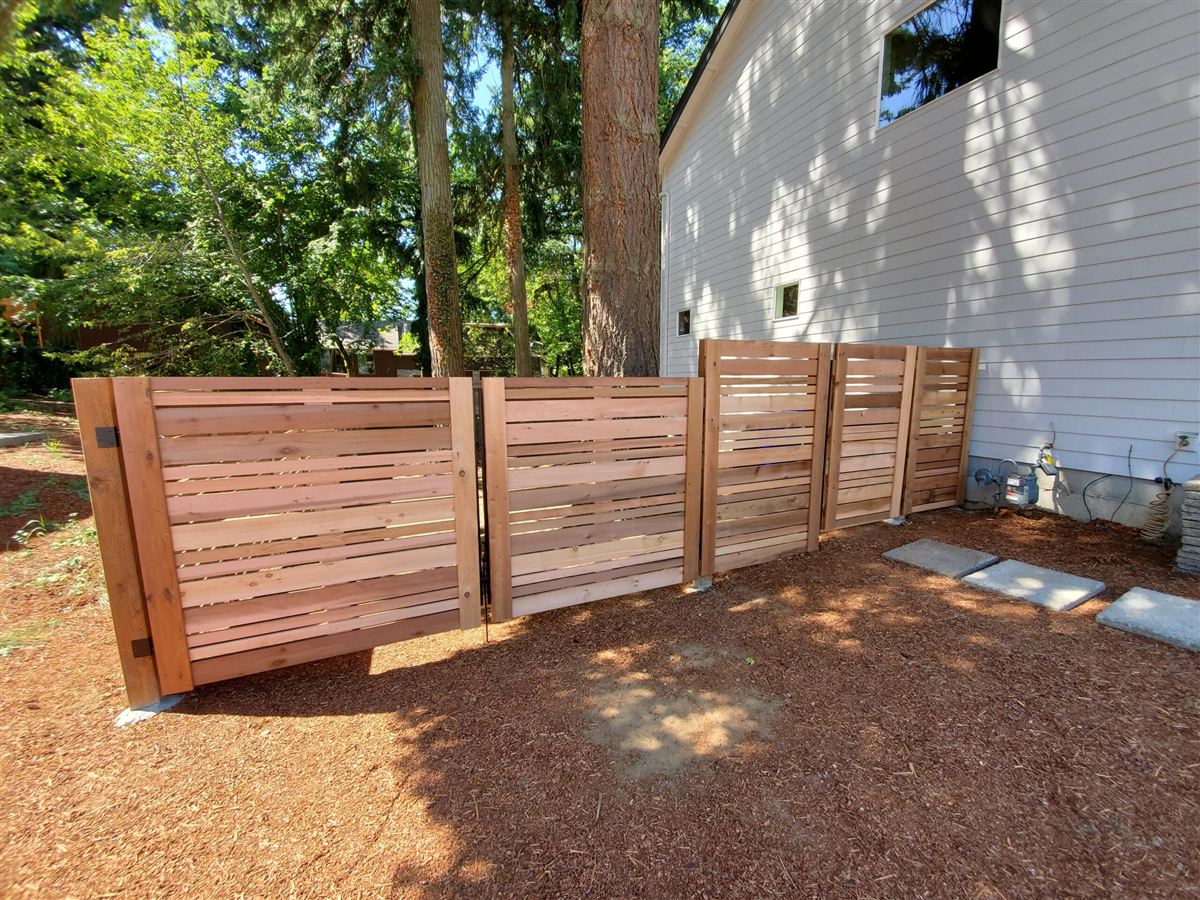 Cedar fence installation by Big Works LLC