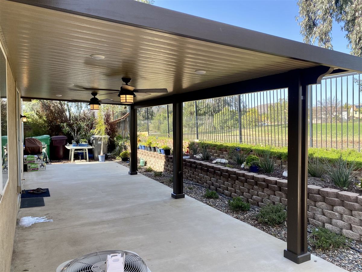 Custom patio cover attached to the back of a home