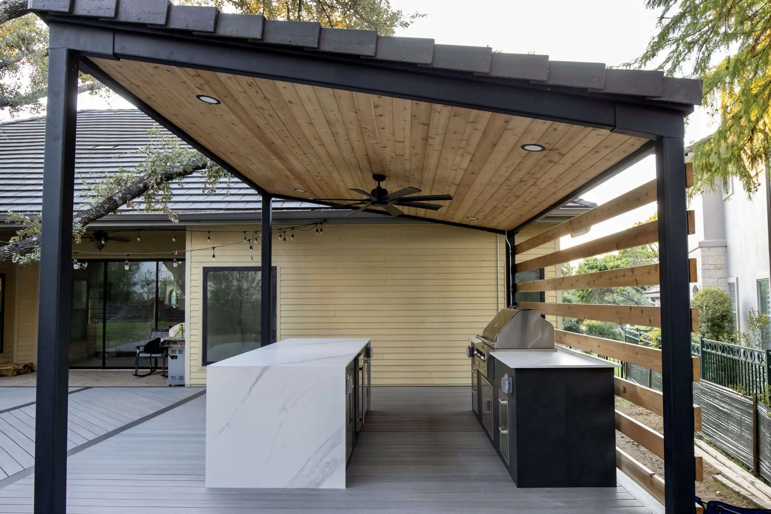 Side view of a wood patio cover with black trim